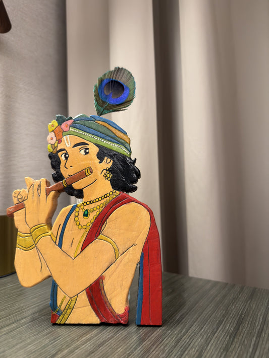 Handcrafted wooden Krishna figurine playing flute with peacock feather turban - front view