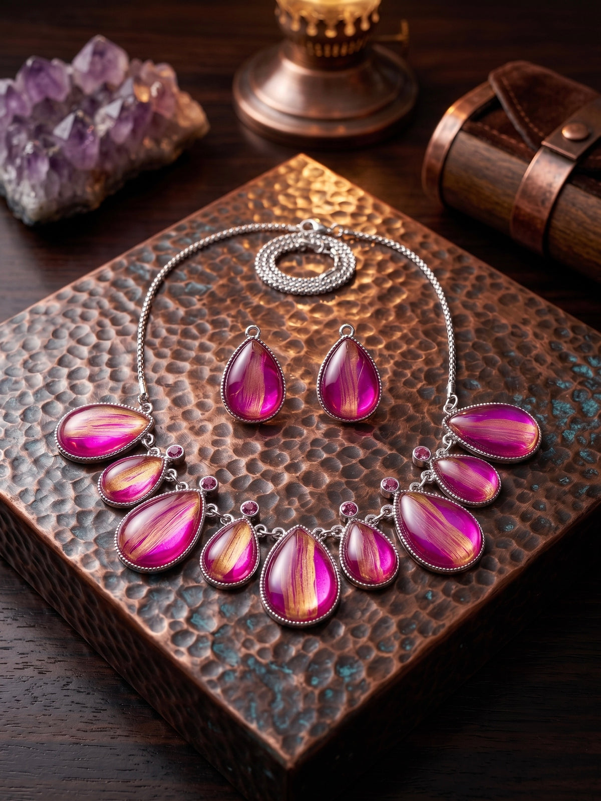 Kyoto pink and gold necklace and earrings on hammered copper tray with amethyst crystal and leather case