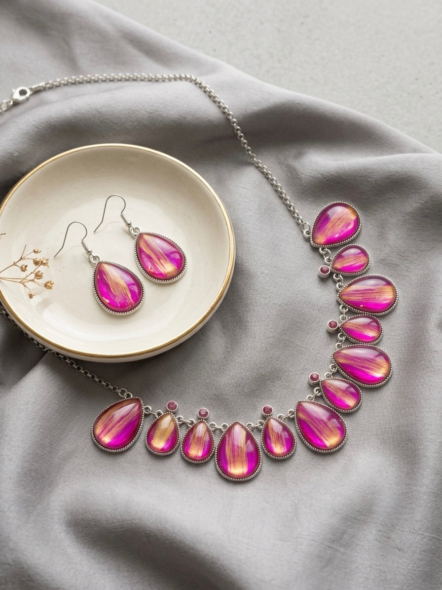 Kyoto pink teardrop jewellery set flat lay on grey silk with ceramic dish