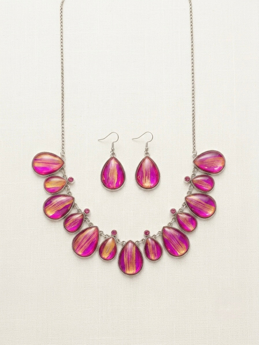 ARTIGAO Kyoto pink and gold necklace earring set on wooden tray with green silk and brand card